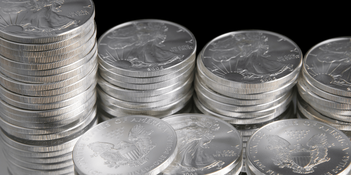 A close up of silver coins on top of each other