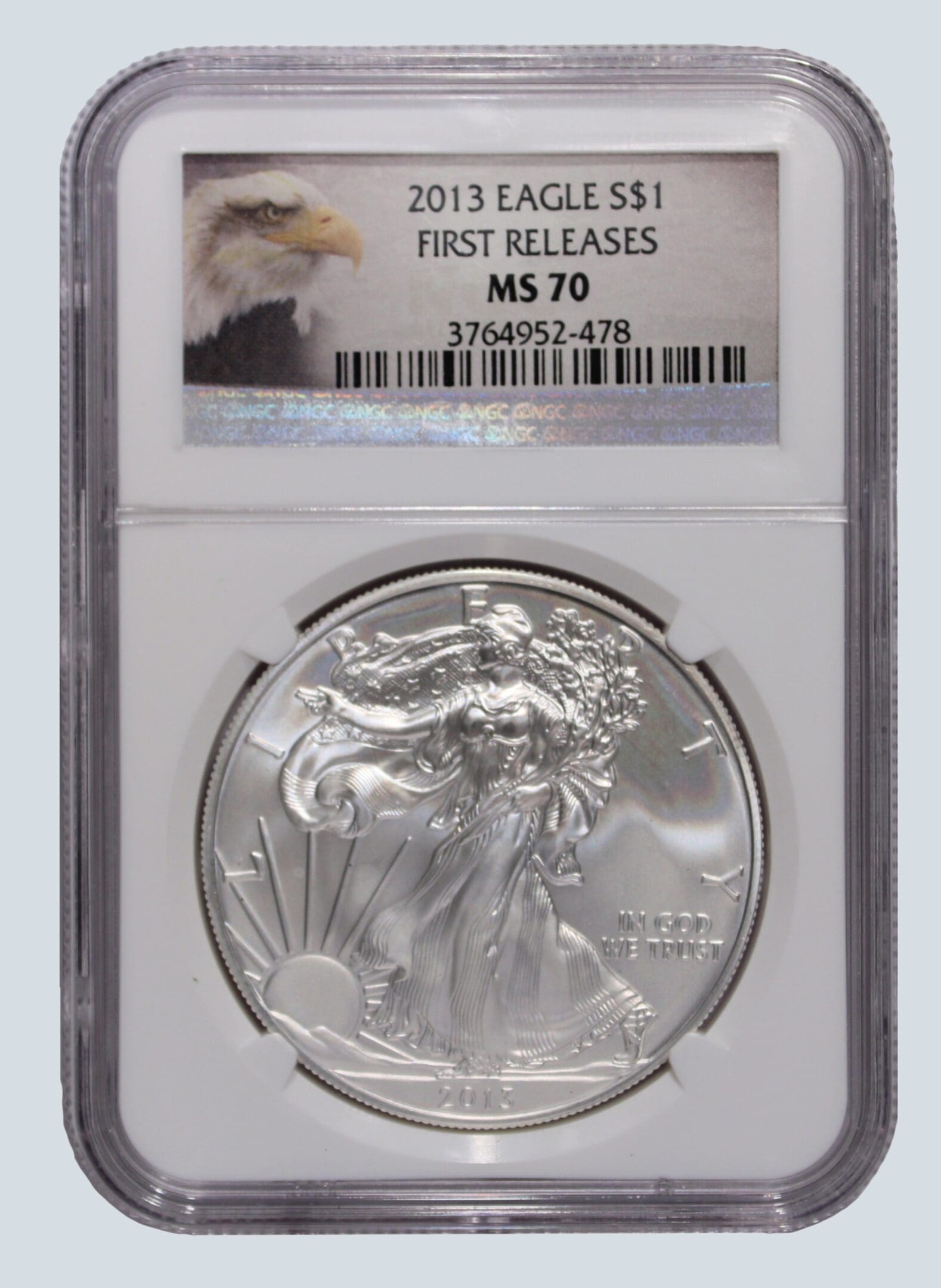 A silver eagle is in an air-tite holder.