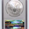 A silver eagle is in an air-tite holder.