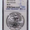 A silver eagle is in an early release case.