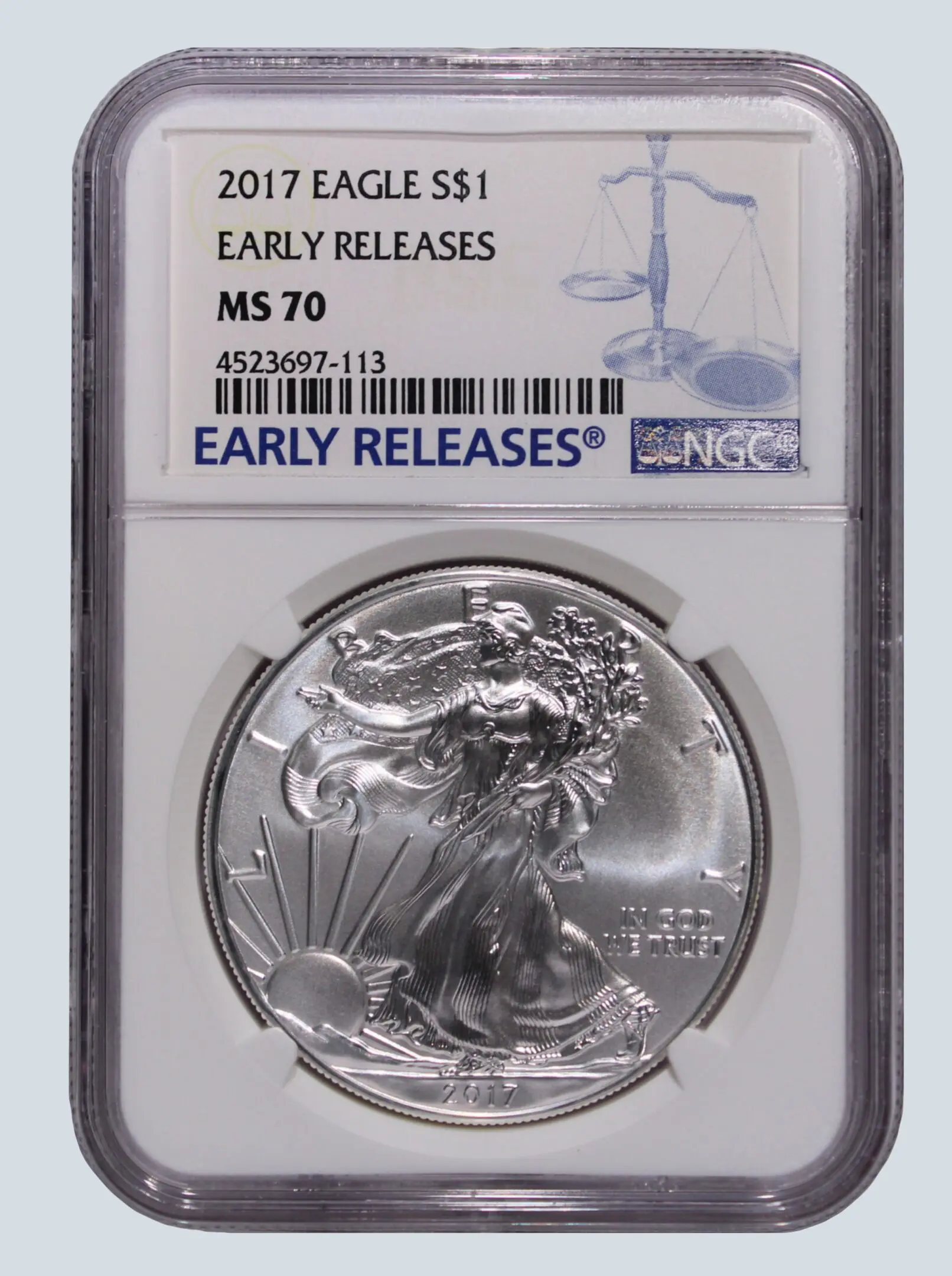 A silver eagle is in an early release case.