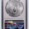 A silver eagle is in an air-tite holder.
