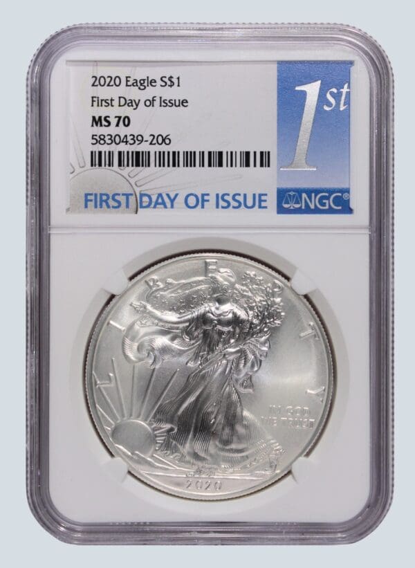 A silver eagle coin is on the first day of issue.